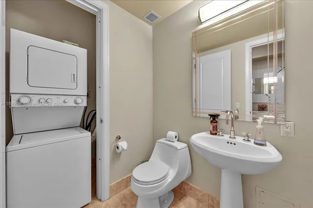 a room with a bed and a flat screen tv