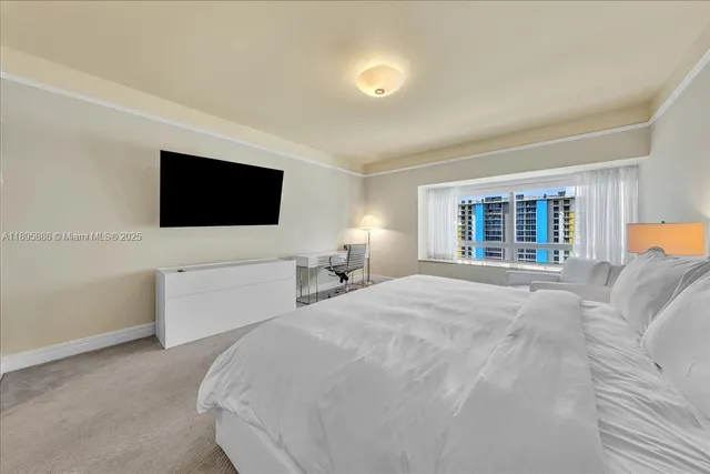 a bedroom with bed and a lamp