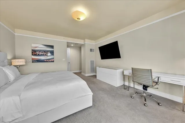 a bathroom with a sink a toilet a mirror and shower