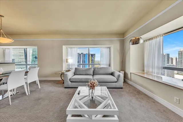 a view of a hallway with bathroom and shower