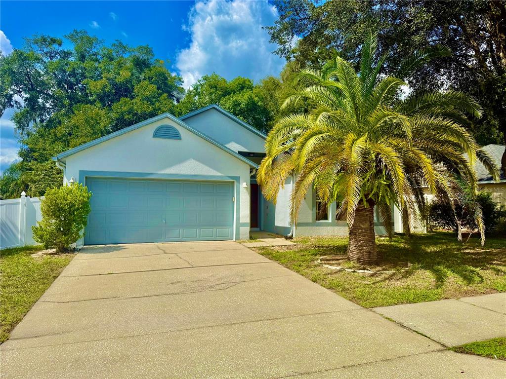 1346 Rolling River Road DeLand, FL 32720 - Photo 1 of 31 a front view of a house with a yard