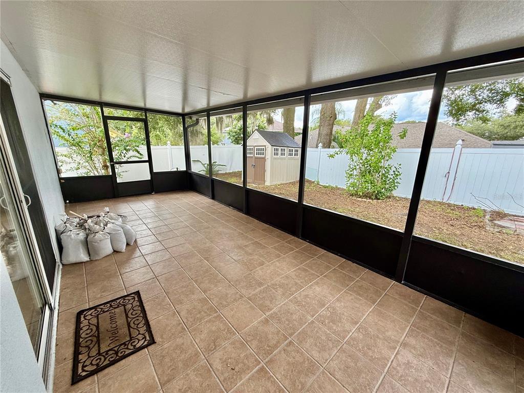 1346 Rolling River Road DeLand, FL 32720 - Photo 26 of 31 a view of an empty room with windows