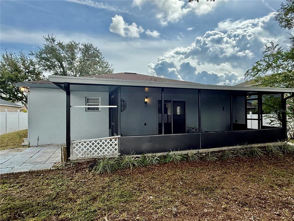 1346 Rolling River Road DeLand, FL 32720 - Photo 28 of 31 a front view of a house with a yard