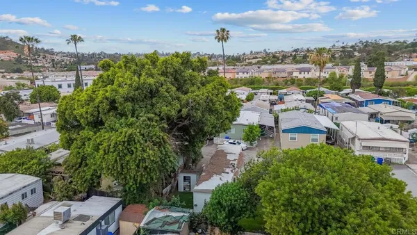 an aerial view of residential houses with outdoor space