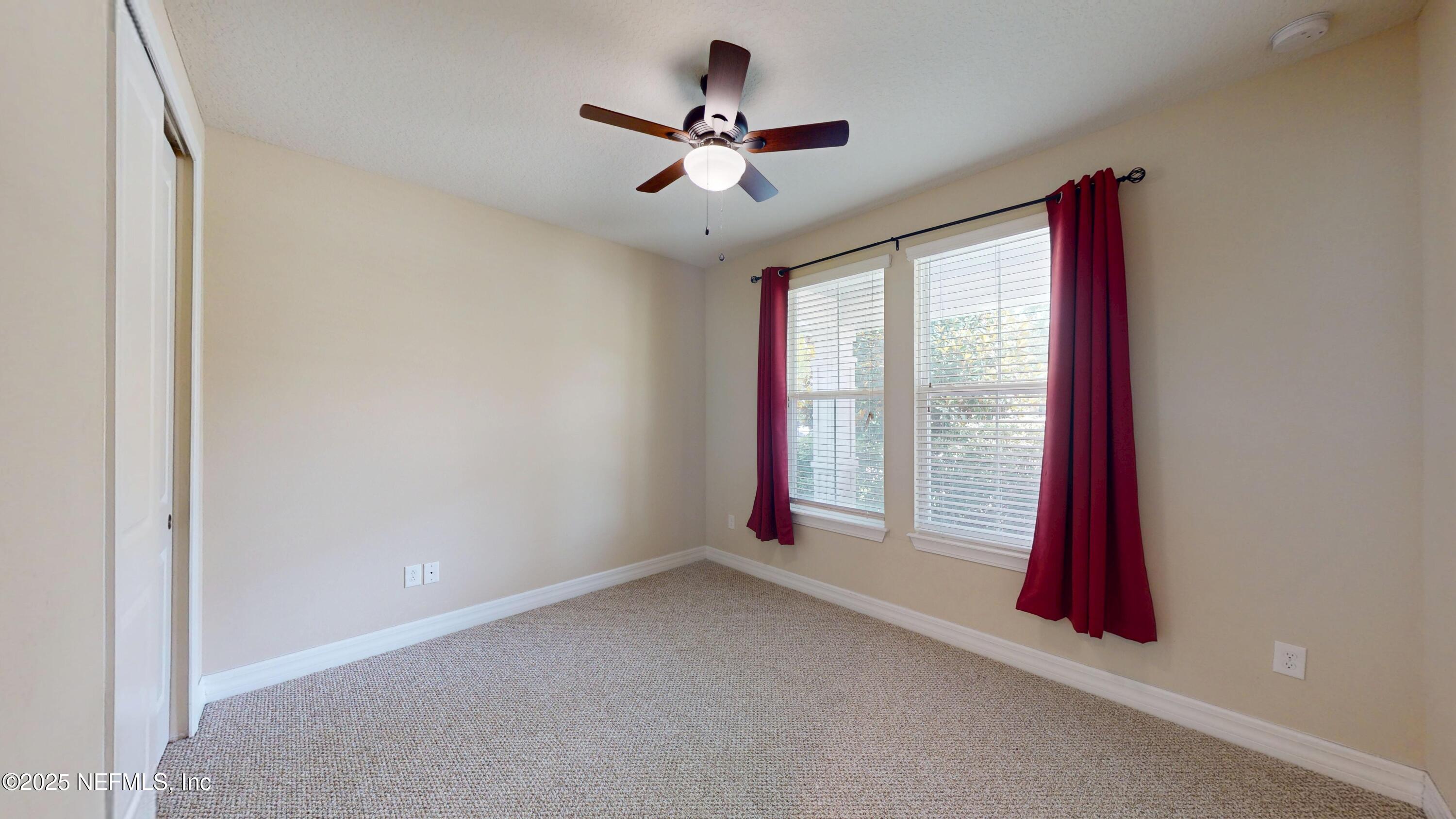29 Lakefront Lane St. Augustine, FL 32095 - Photo 17 of 32 an empty room with windows and fan