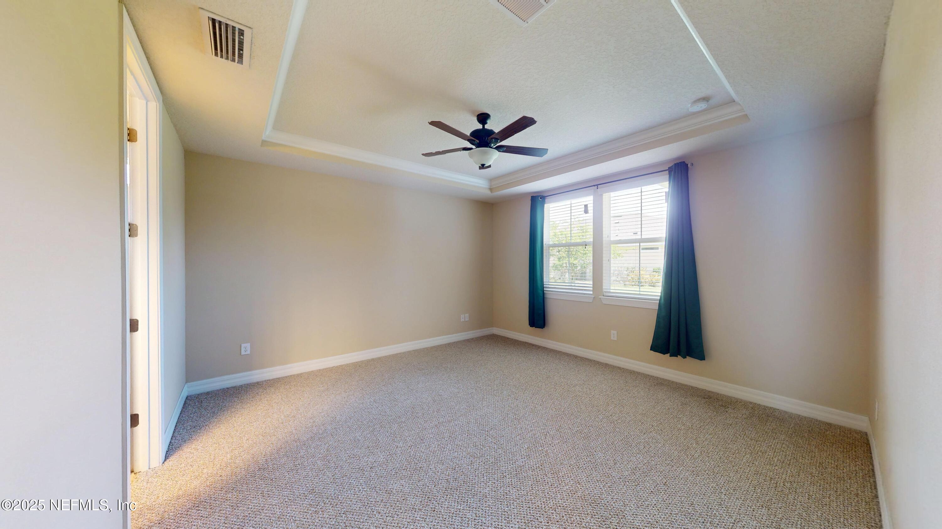 29 Lakefront Lane St. Augustine, FL 32095 - Photo 19 of 32 a view of a livingroom with a ceiling fan and window
