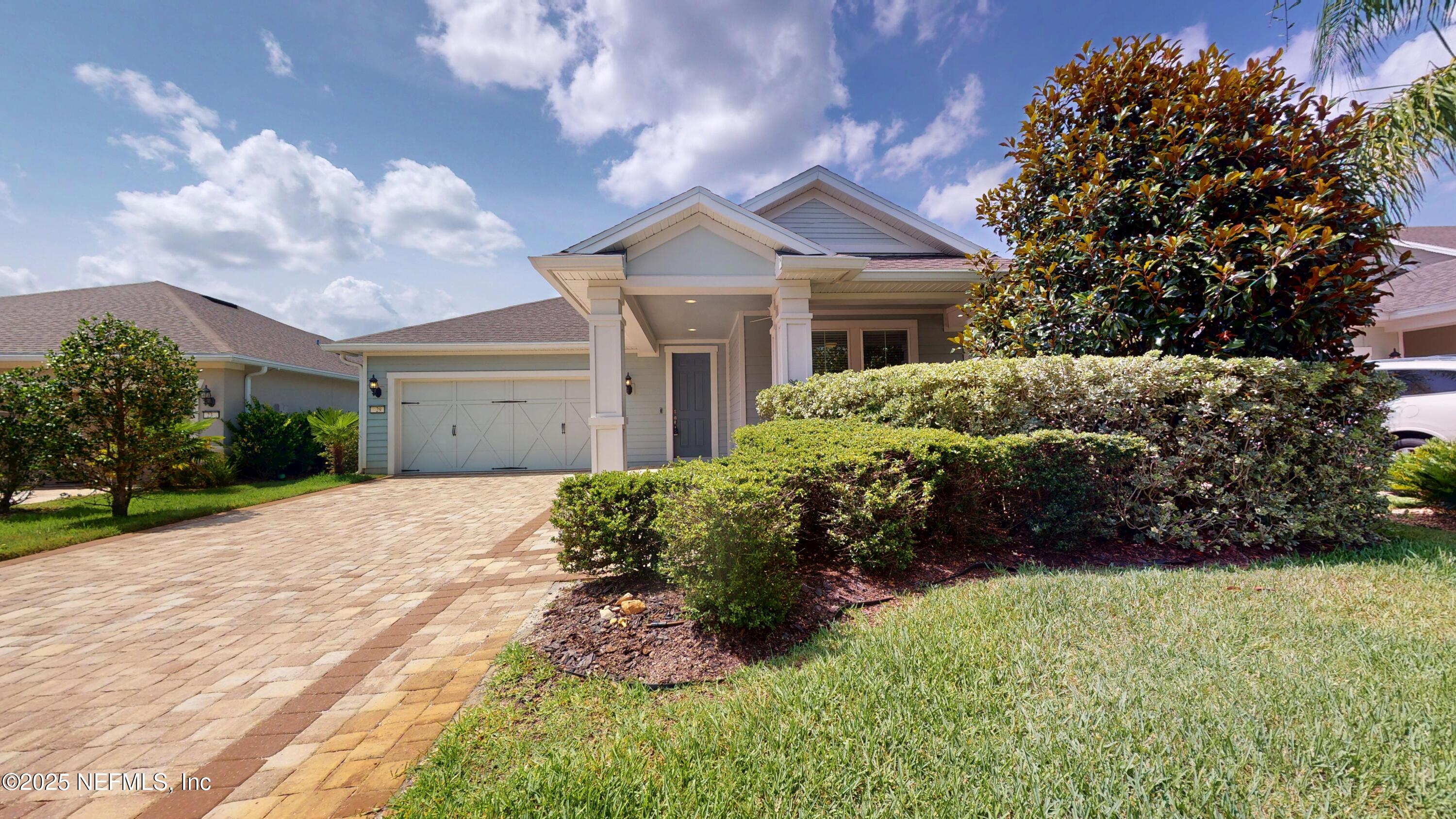 29 Lakefront Lane St. Augustine, FL 32095 - Photo 2 of 32 a front view of a house with a garden
