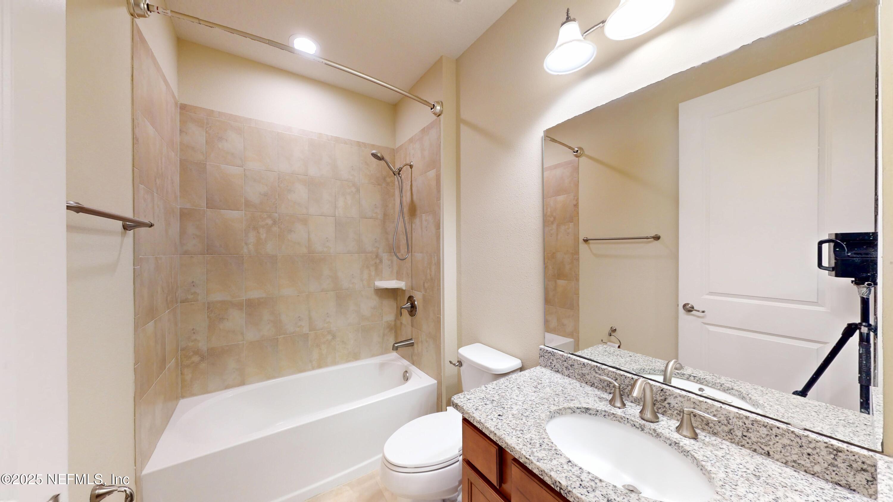 29 Lakefront Lane St. Augustine, FL 32095 - Photo 8 of 32 a bathroom with a granite countertop sink toilet and shower