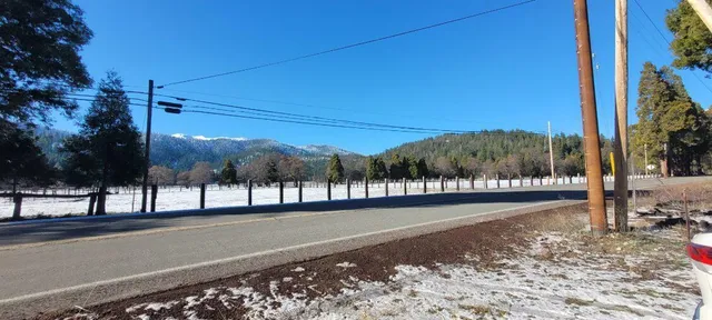 a view of a street with a building in the background