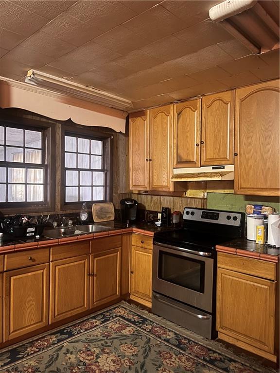 96 Jesse Johnson Street Blakely, GA 39823 - Photo 2 of 6 a kitchen with stainless steel appliances a stove a sink a stove and white cabinets