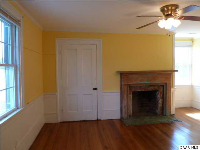 803 Valley View Road Ruckersville, VA 22968 - Photo 15 of 21 a view of a livingroom with a fireplace and wooden floor