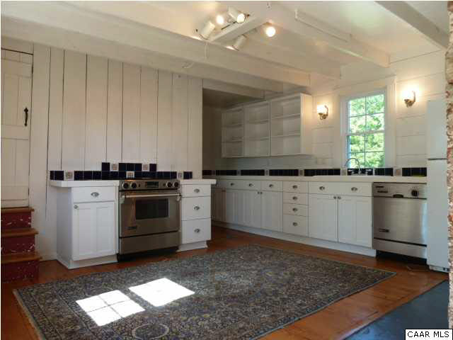 803 Valley View Road Ruckersville, VA 22968 - Photo 3 of 21 a kitchen with granite countertop white cabinets and white appliances
