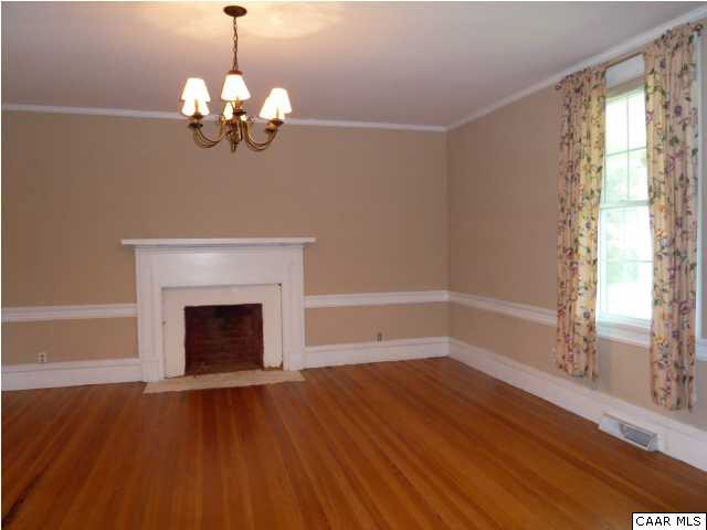 803 Valley View Road Ruckersville, VA 22968 - Photo 8 of 21 a view of an empty room with wooden floor and a window