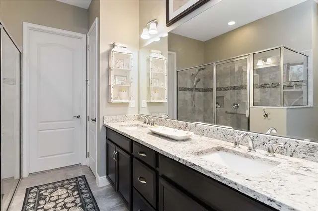 a bedroom with bed couch and window