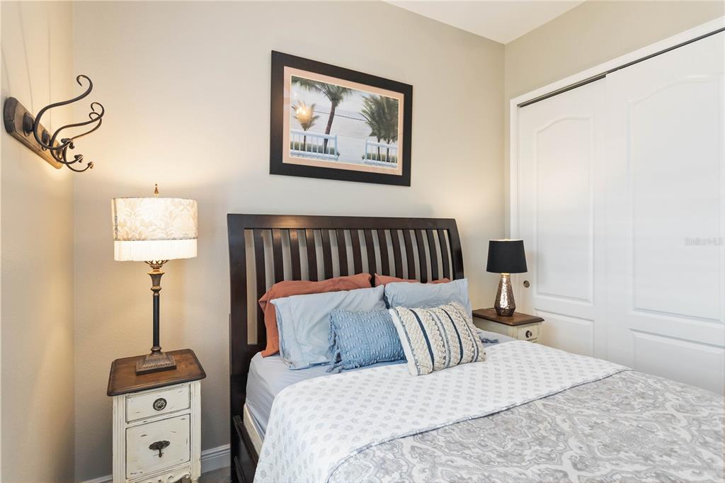 2463 Datura Loop St. Cloud, FL 34772 - Photo 32 of 57 a bed room with a bed and a night stand