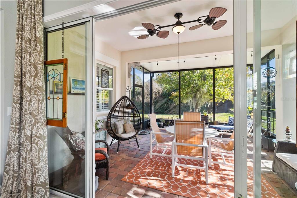2463 Datura Loop St. Cloud, FL 34772 - Photo 35 of 57 a living room with furniture and a floor to ceiling window