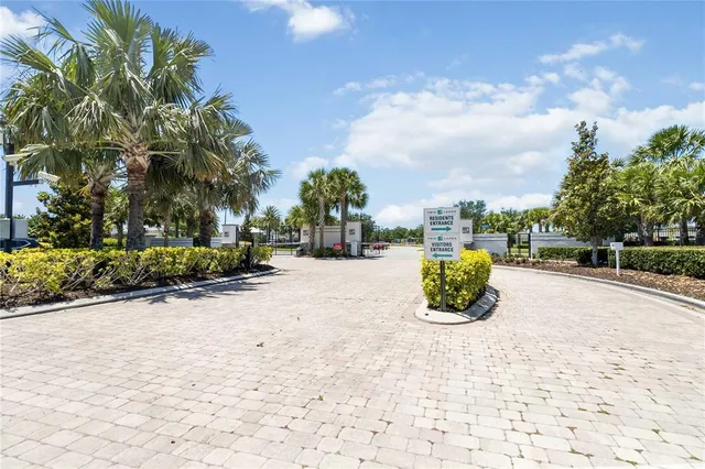 a view of a kitchen counter space with wooden floor and cabinets