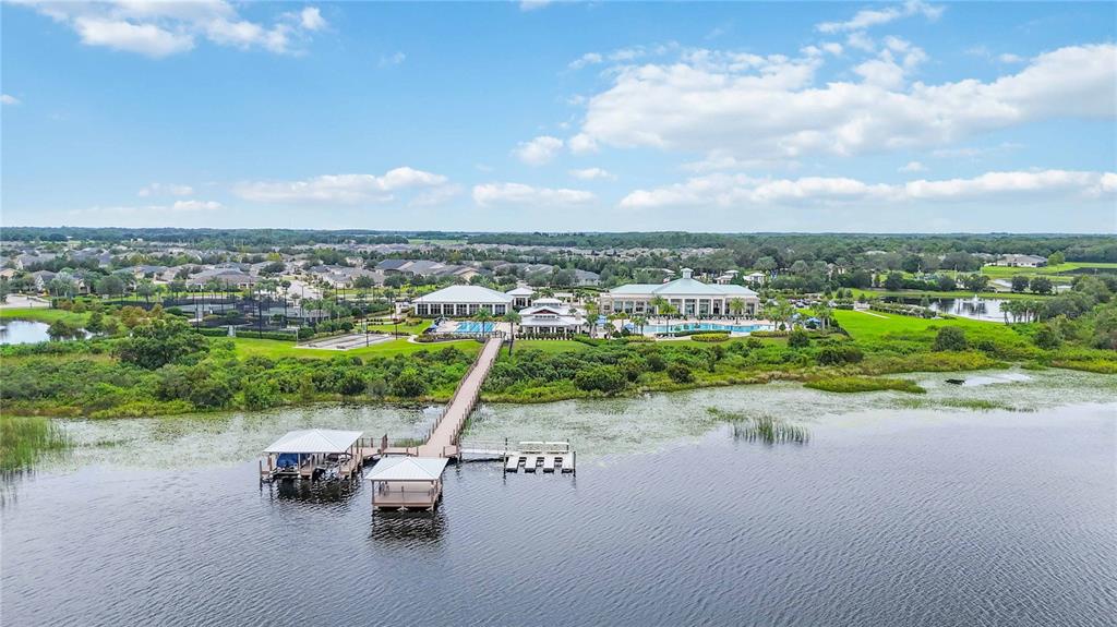 2463 Datura Loop St. Cloud, FL 34772 - Photo 47 of 57 a view of a lake with a yard