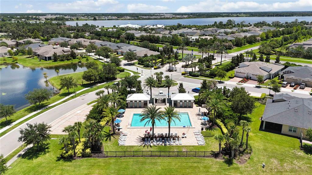 2463 Datura Loop St. Cloud, FL 34772 - Photo 48 of 57 an aerial view of a house with a garden and lake view