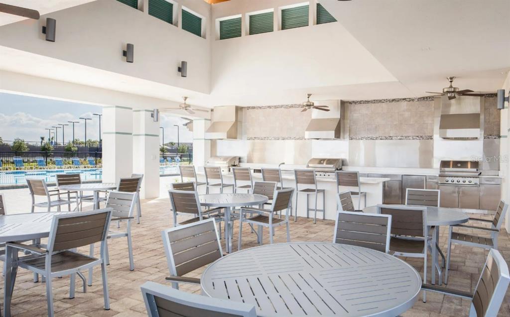 2463 Datura Loop St. Cloud, FL 34772 - Photo 56 of 57 a living room with lots of furniture and a large window