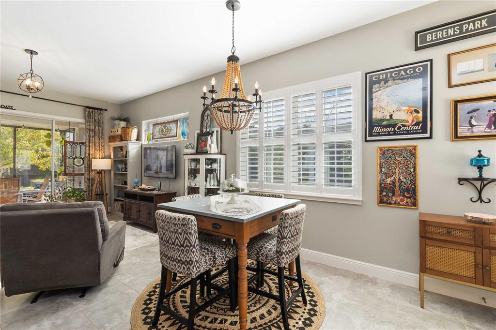 2463 Datura Loop St. Cloud, FL 34772 - Photo 9 of 57 a view of a dining room with furniture window and wooden floor