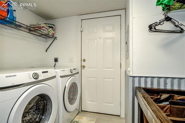 5705 Whipshaw Road Peyton, CO 80831 - Photo 19 of 34 Laundry Room with door to back yard