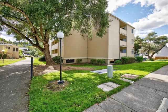 a view of a street with a parked cars