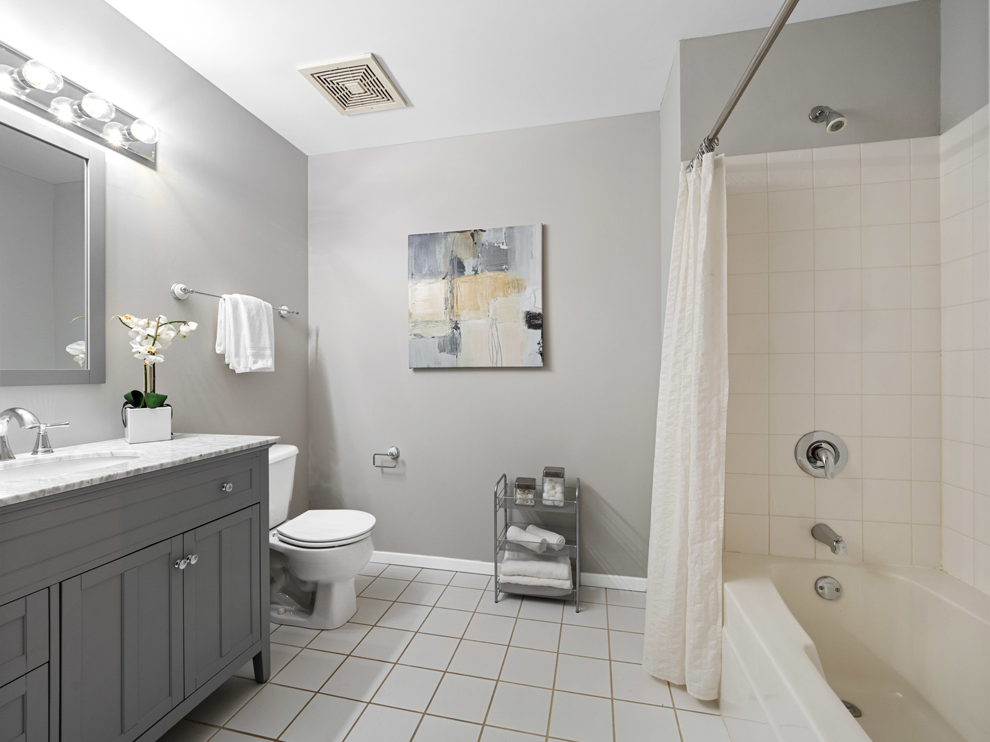 933 West Van Buren Street, Unit 708 Chicago, IL 60607 - Photo 19 of 23 a bathroom with a sink toilet and shower