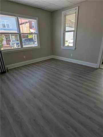 a kitchen with stainless steel appliances granite countertop a table chairs sink and cabinets