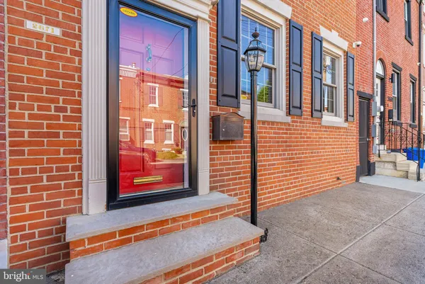 a view of a brick building with many windows