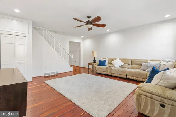 a living room with furniture and a rug
