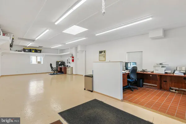 a view of a kitchen with furniture and a kitchen