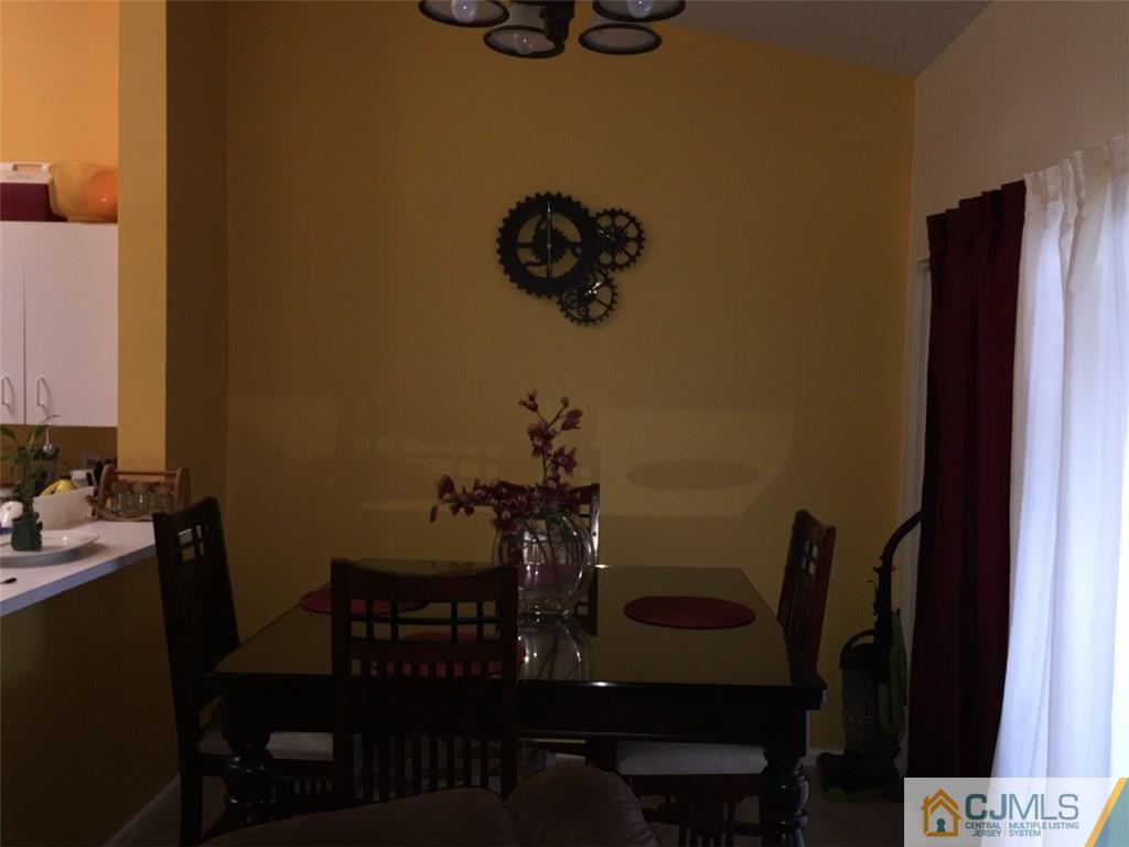 531 Edpas Road, Unit 531 New Brunswick, NJ 08901 - Photo 4 of 9 a view of a dining room with furniture and wooden floor