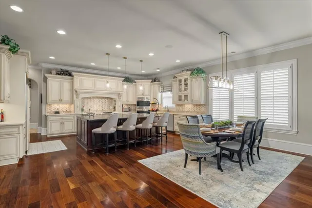 a spacious bathroom with a sink mirror and window
