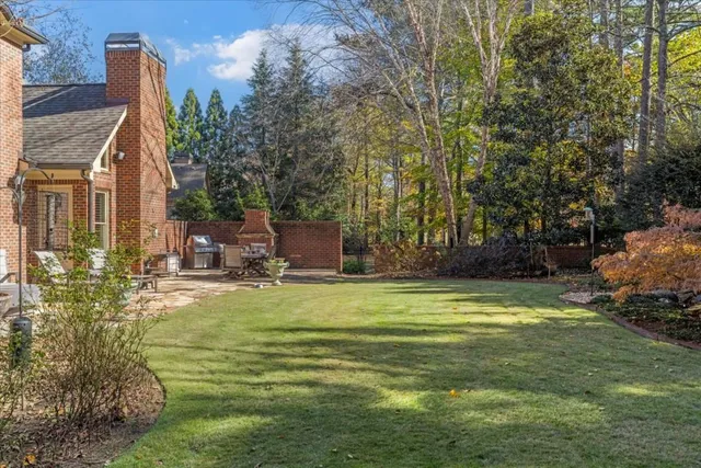 a swimming pool with some trees in the background