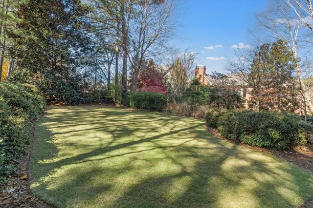 a front view of a house with outdoor seating
