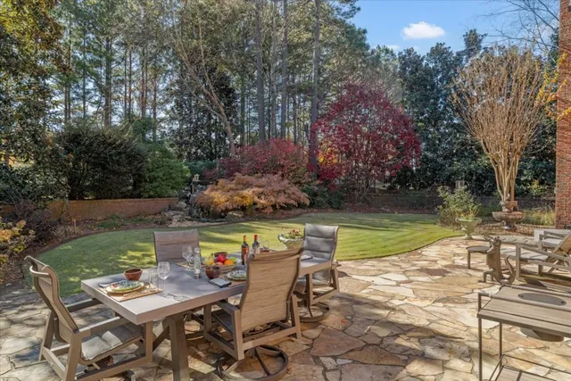 a view of a hallway with workspace and living room
