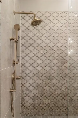 a patio with table and chairs under an umbrella