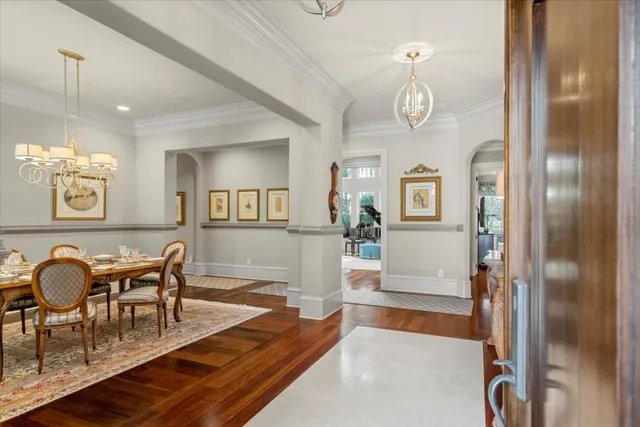 a living room with furniture and a mirror
