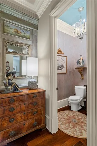 a living room with fireplace furniture and a large window