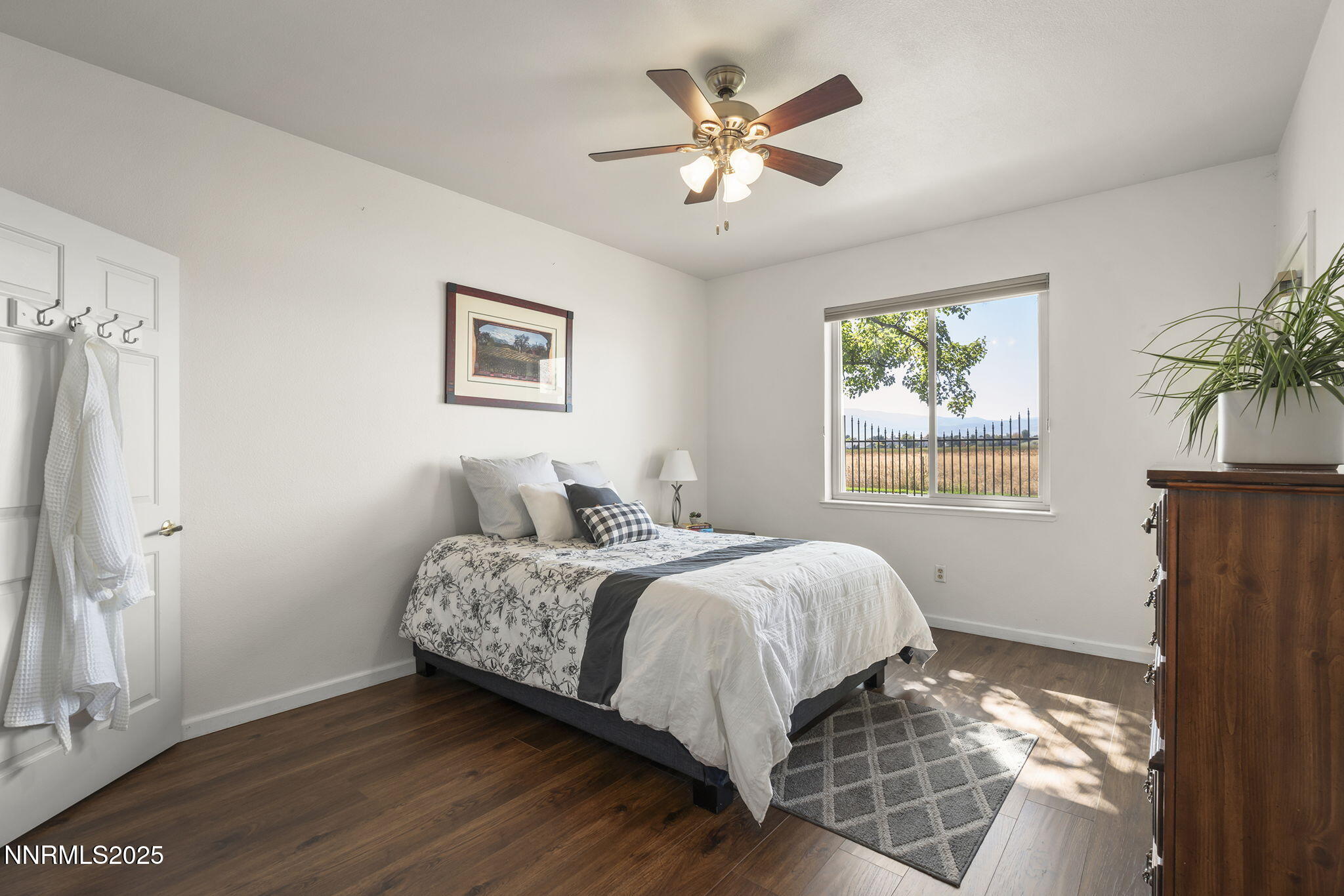 900 South Meadows Parkway, Unit 4313 Reno, NV 89521 - Photo 12 of 27 a bedroom with a bed and a window
