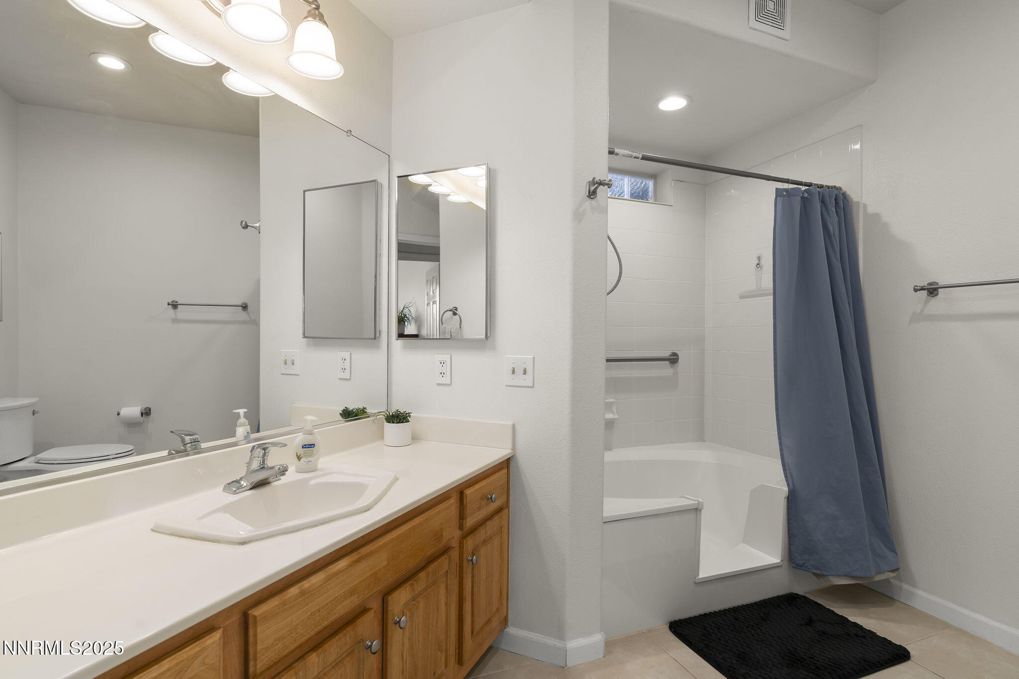 900 South Meadows Parkway, Unit 4313 Reno, NV 89521 - Photo 14 of 27 a bathroom with a double vanity sink mirror double and shower