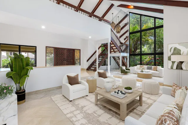 a spacious bedroom with a balcony a bed and a fireplace