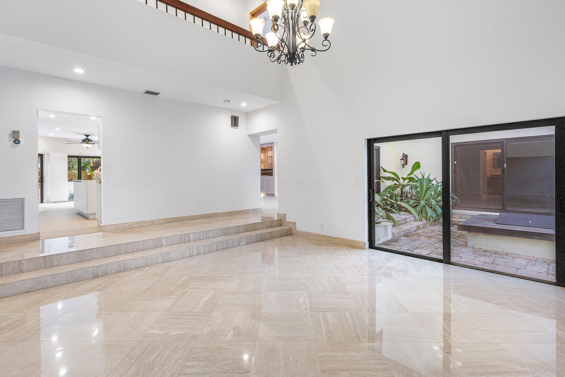 4140 Sanctuary Lane Boca Raton, FL 33431 - Photo 15 of 94 a view of a livingroom with a chandelier fan and windows