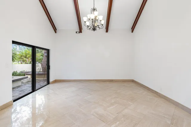 a view of a park with a tree in the background