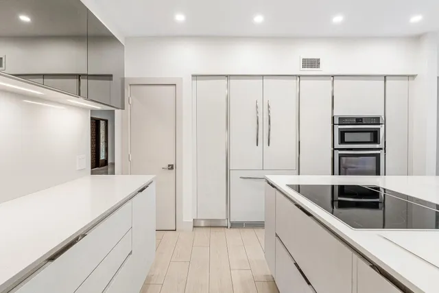 an aerial view of a house with a yard and garden