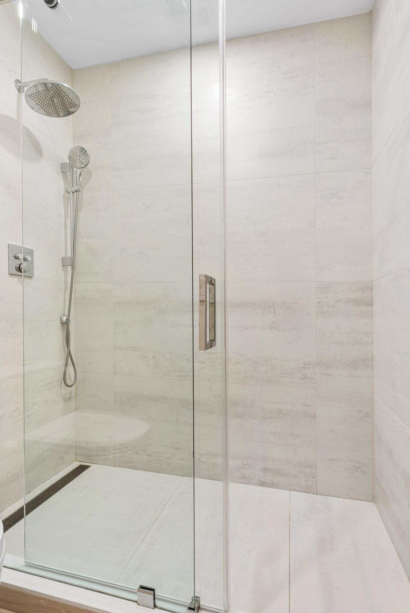 4140 Sanctuary Lane Boca Raton, FL 33431 - Photo 35 of 94 a bathroom with a bathtub and a shower