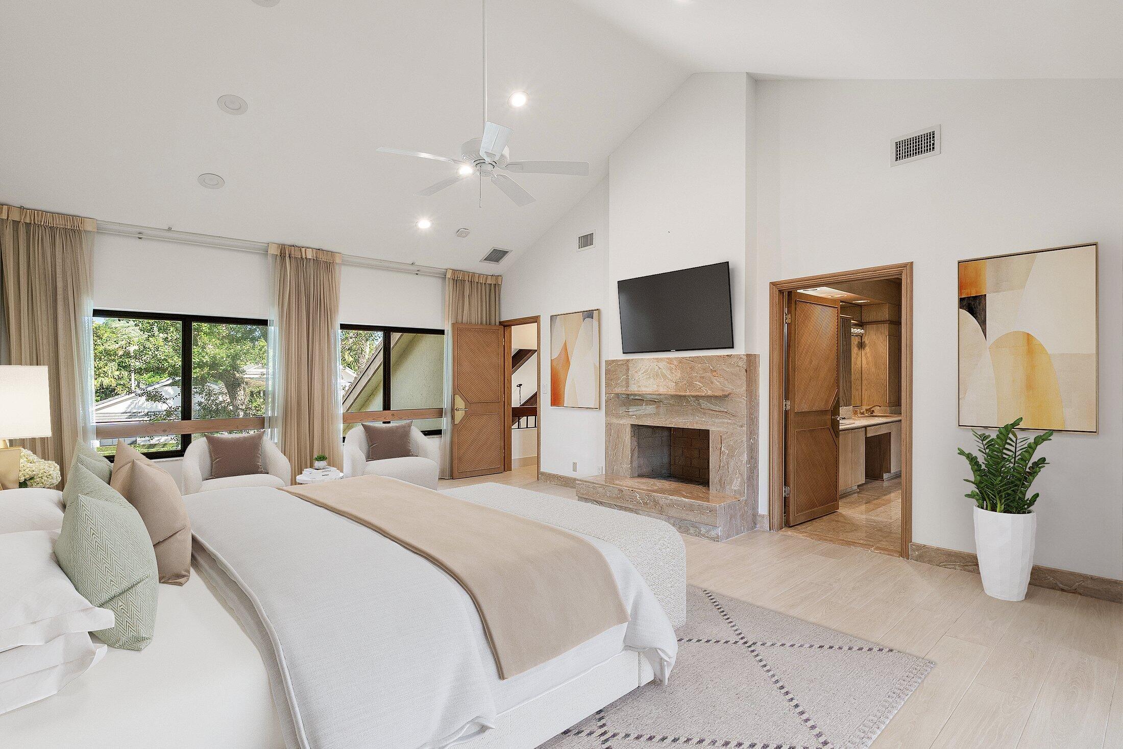 4140 Sanctuary Lane Boca Raton, FL 33431 - Photo 51 of 94 a spacious bedroom with a balcony a bed and a fireplace