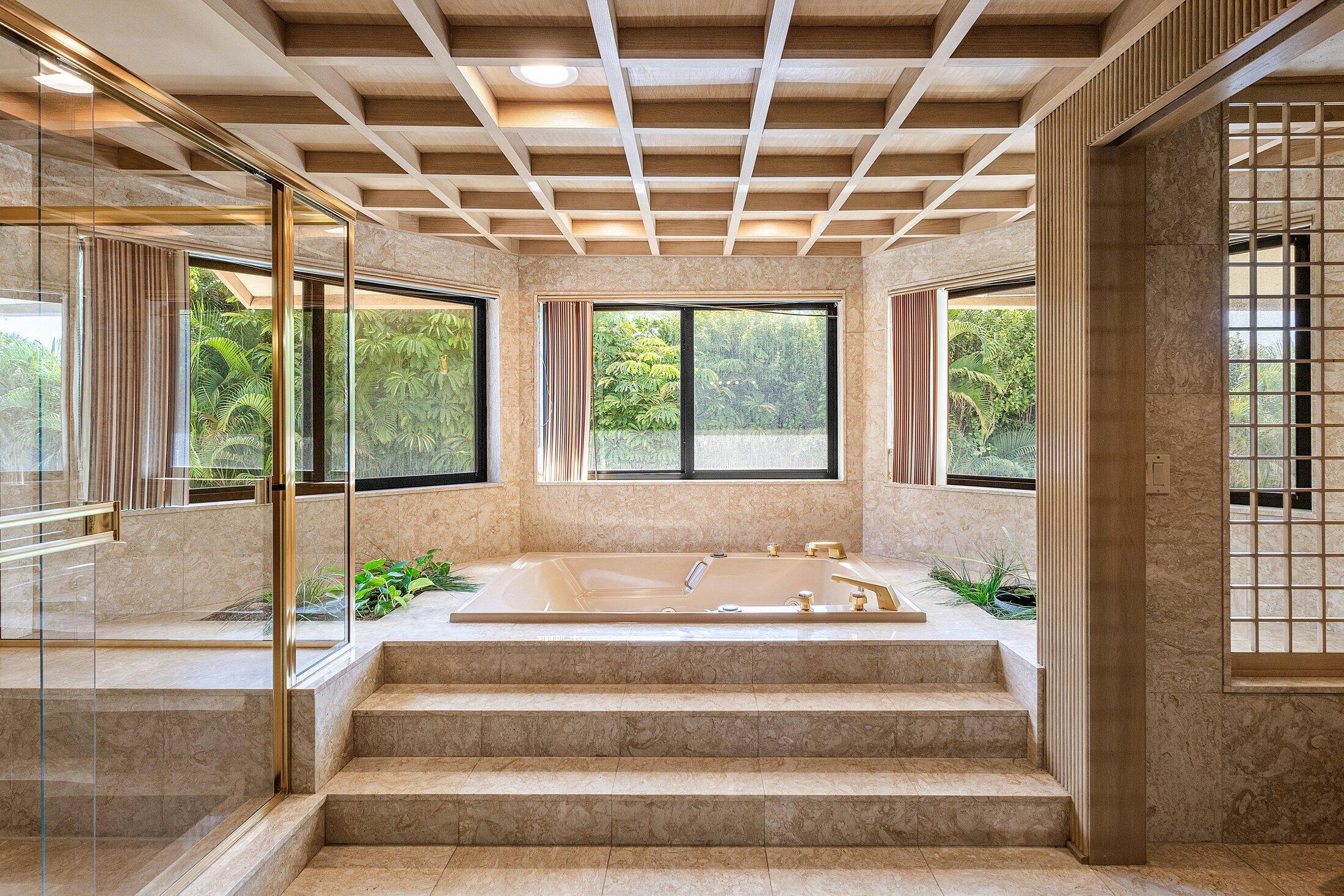 4140 Sanctuary Lane Boca Raton, FL 33431 - Photo 58 of 94 a front view of a house with potted plants and windows