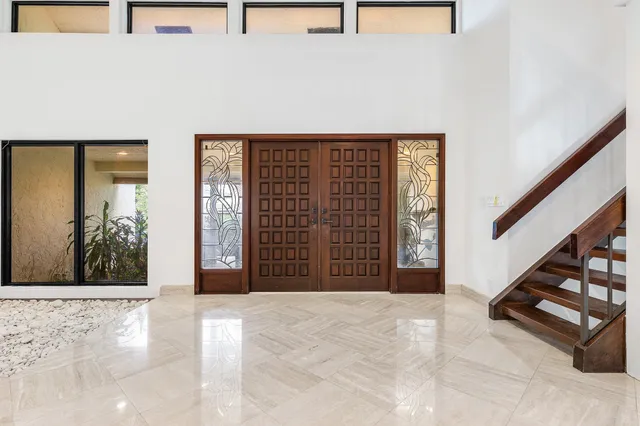 a kitchen with stainless steel appliances a refrigerator and a sink